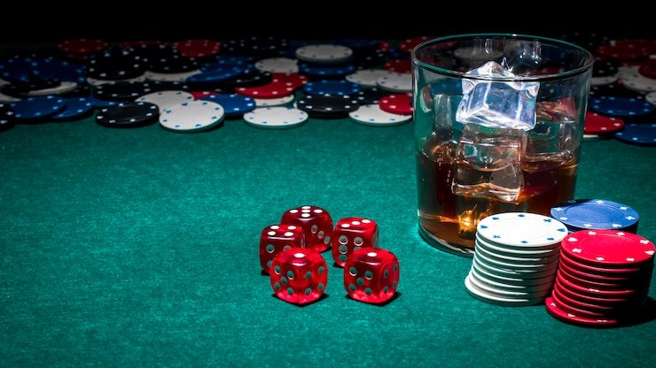 Live blackjack dealer at gaming table with side bet display